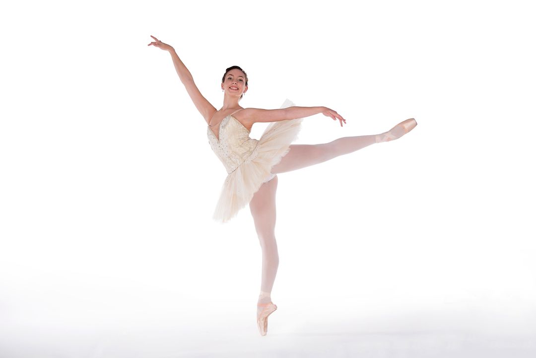 Ballerina in tutu arabesque pose
